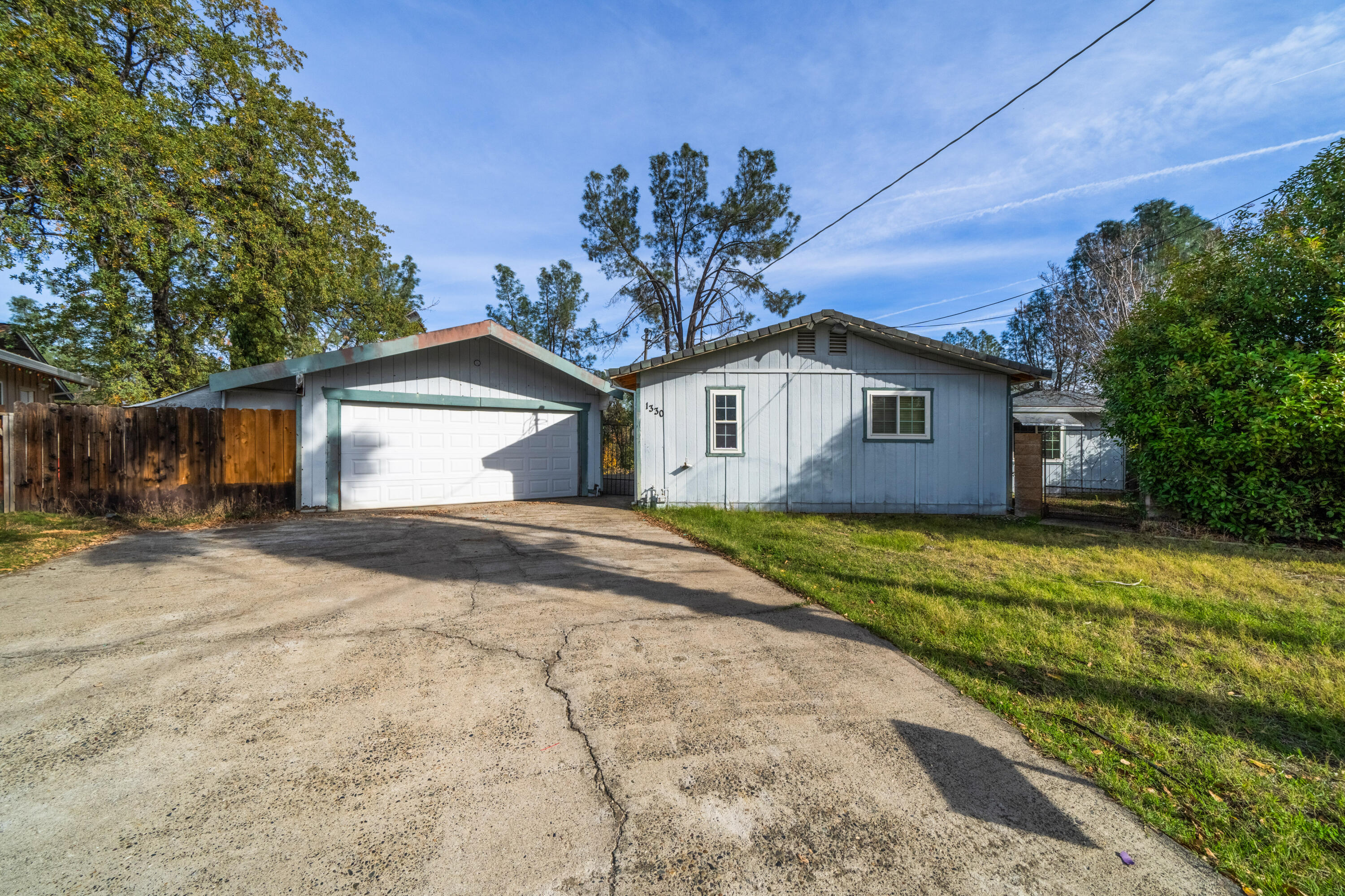 1330 Scenic Way Redding, CA 96001 - Photo 2 of 43 a view of a house with a yard and potted plants