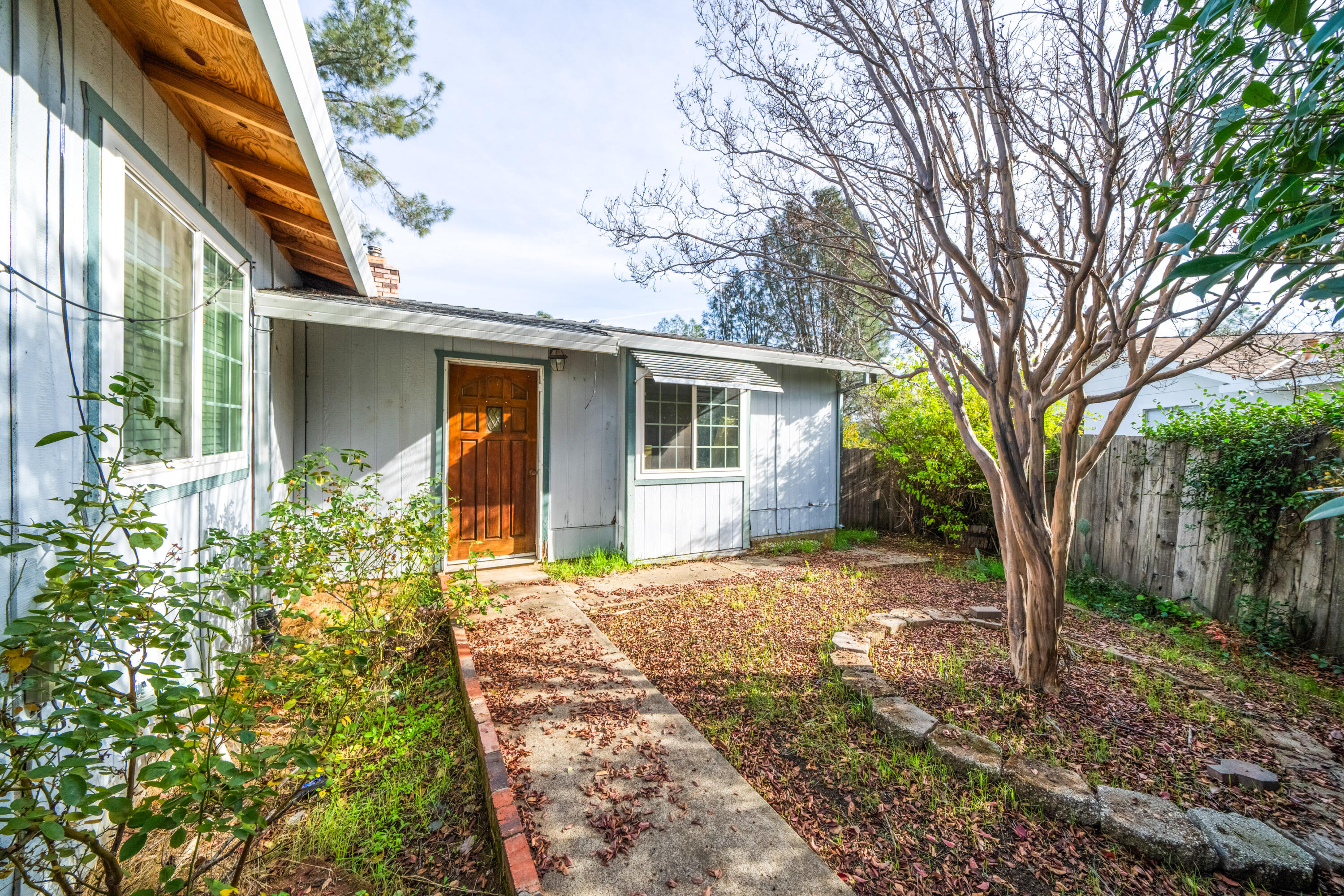 1330 Scenic Way Redding, CA 96001 - Photo 3 of 43 a front view of a house with garden