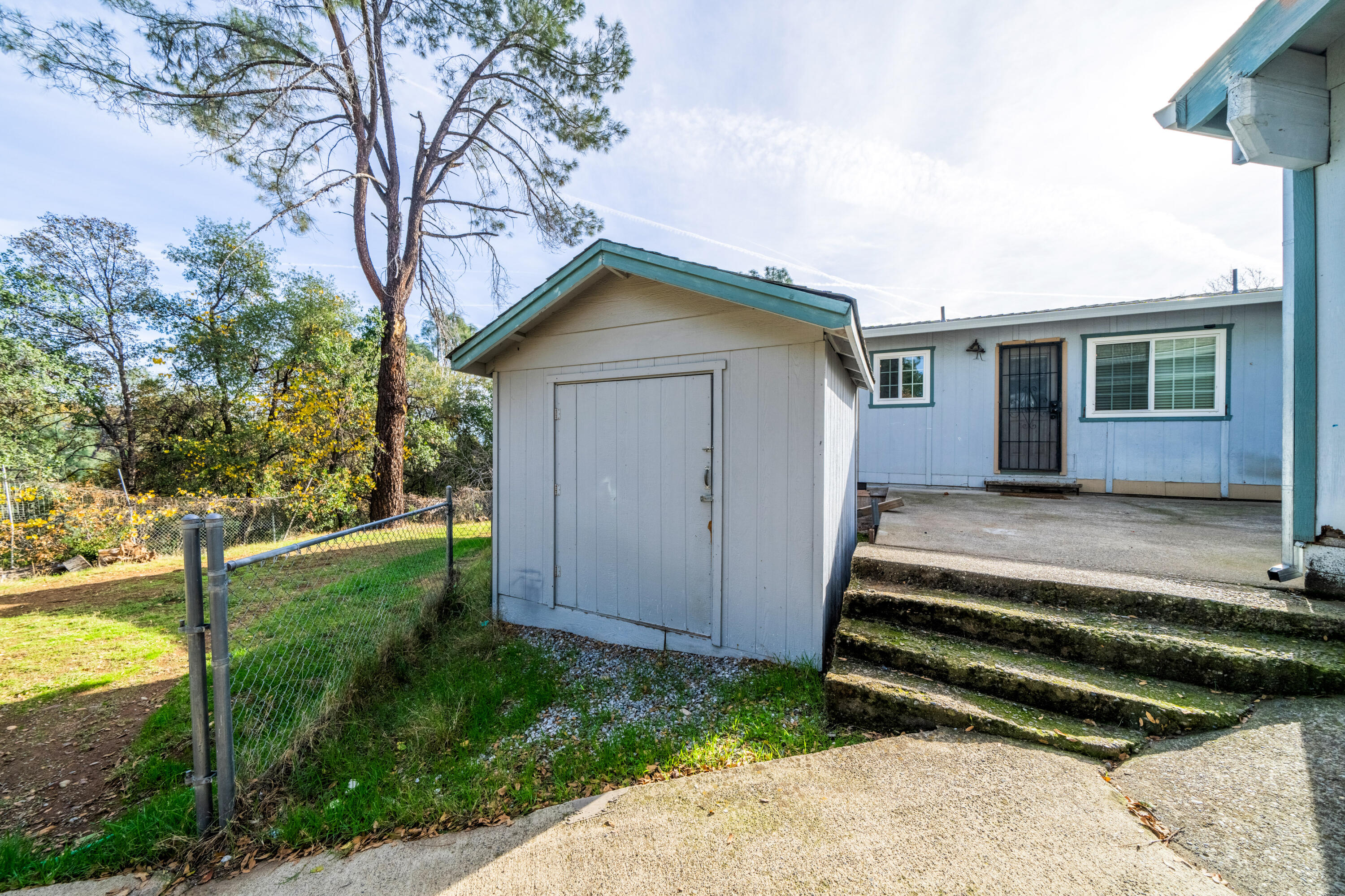 1330 Scenic Way Redding, CA 96001 - Photo 31 of 43 a view of backyard of house with wooden fence