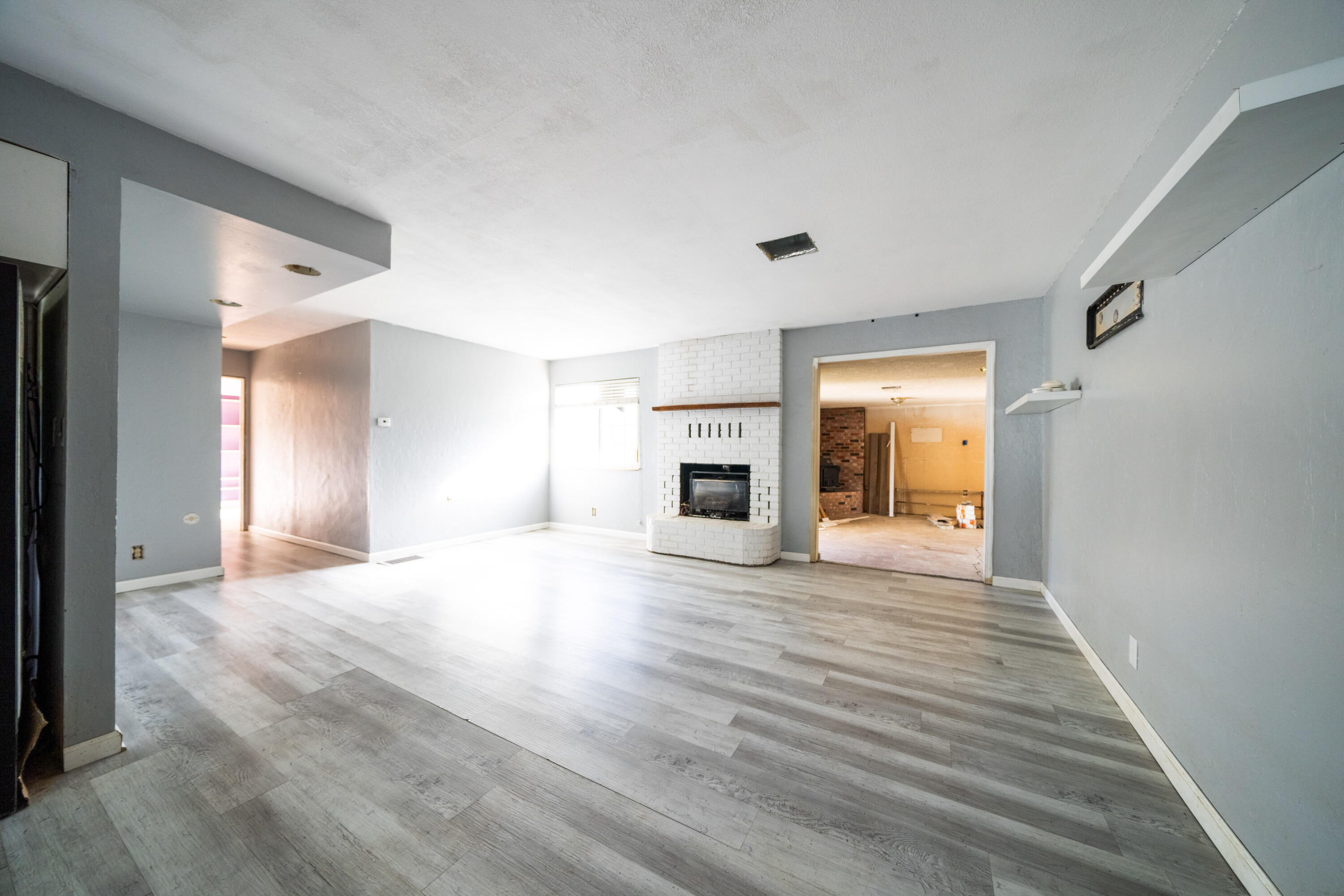 1330 Scenic Way Redding, CA 96001 - Photo 5 of 43 a view of a livingroom with wooden floor and a fireplace
