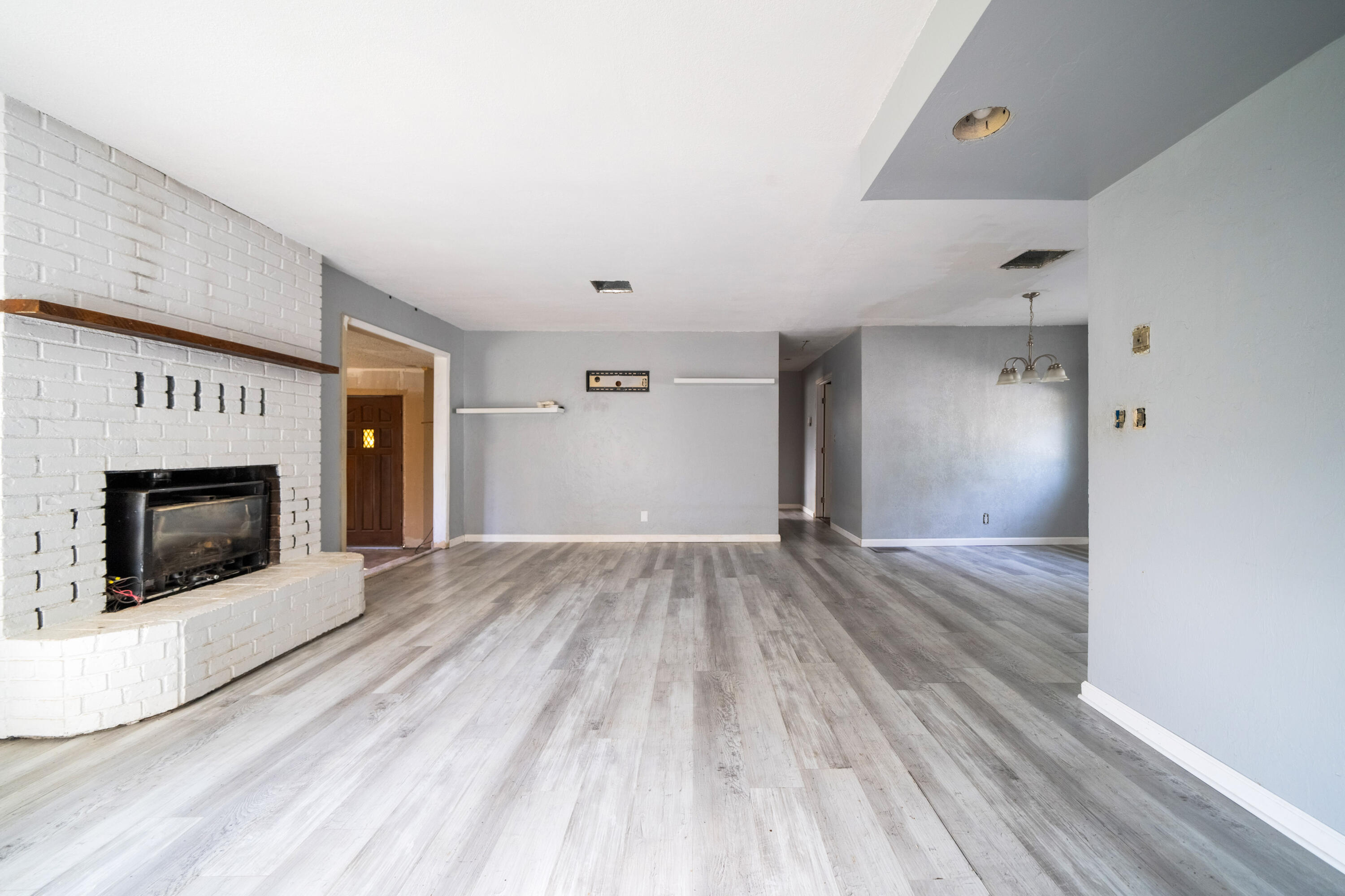 1330 Scenic Way Redding, CA 96001 - Photo 7 of 43 a view of empty room with wooden floor and fireplace