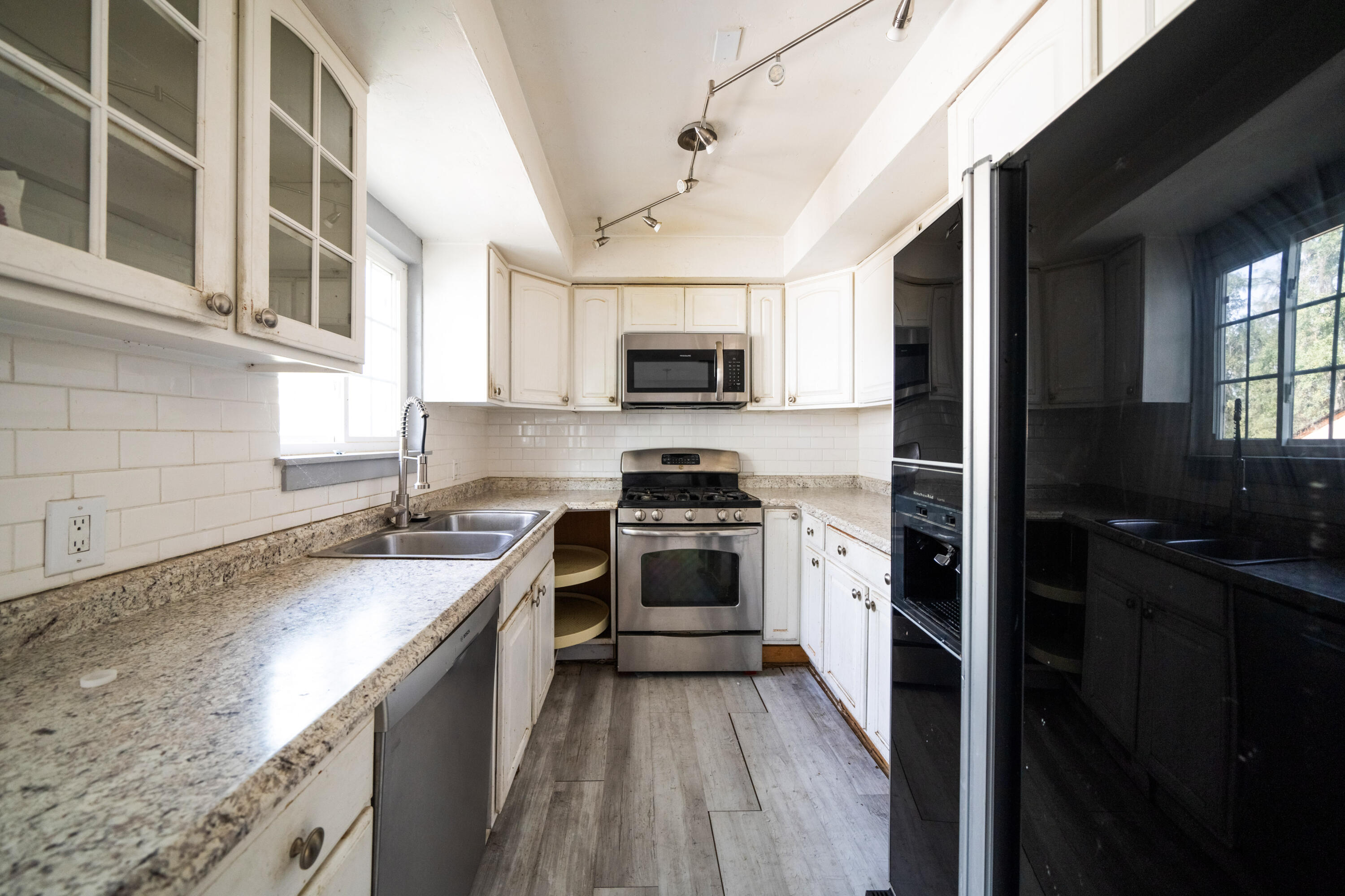 1330 Scenic Way Redding, CA 96001 - Photo 9 of 43 a kitchen with a sink stove and microwave