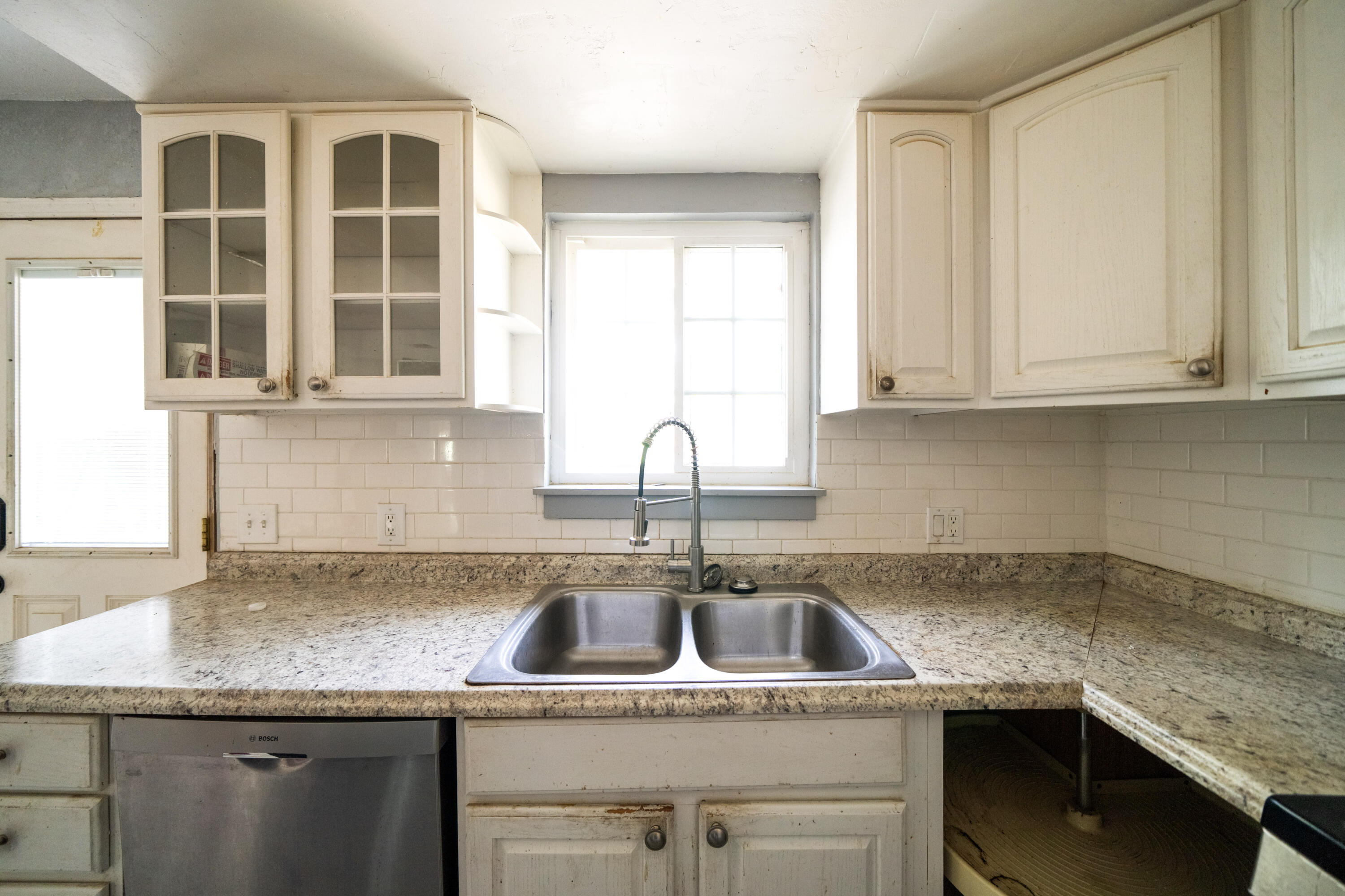 1330 Scenic Way Redding, CA 96001 - Photo 10 of 43 a kitchen with granite countertop a sink and cabinets