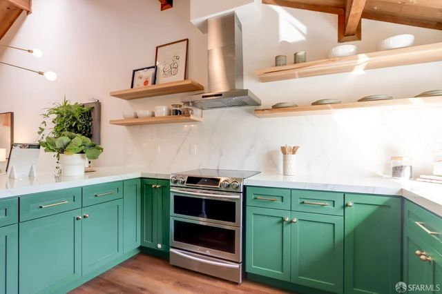a kitchen with cabinets and window