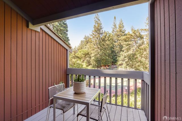 a view of a balcony with furniture