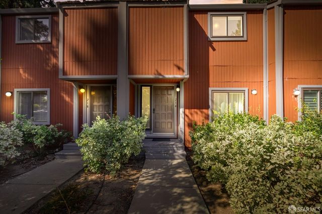front view of a house with a small yard