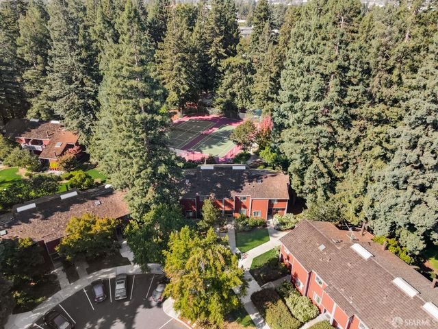 a aerial view of a house with a yard