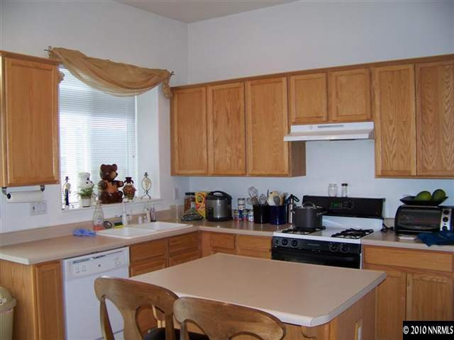 1920 Stargaze Way Reno, NV 89523 - Photo 5 of 11 a kitchen with stainless steel appliances granite countertop a sink stove and refrigerator