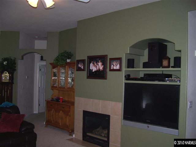 1920 Stargaze Way Reno, NV 89523 - Photo 8 of 11 a living room with furniture and a fireplace