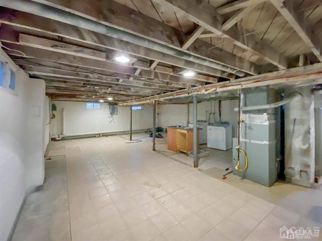 15 Racetrack Road East Brunswick, NJ 08816 - Photo 11 of 13 a view of empty room with wooden ceiling
