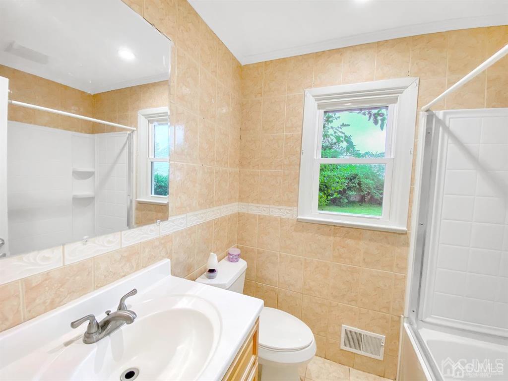 15 Racetrack Road East Brunswick, NJ 08816 - Photo 7 of 13 a bathroom with a sink toilet and shower