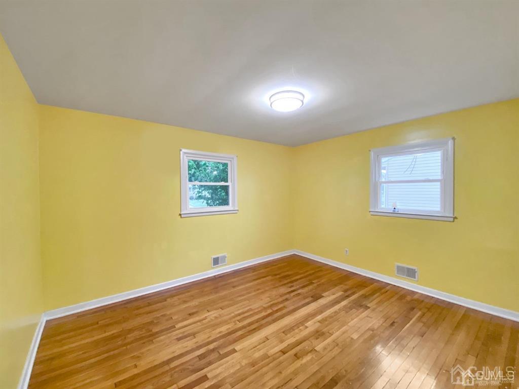 15 Racetrack Road East Brunswick, NJ 08816 - Photo 9 of 13 a view of a room with wooden floor and a window