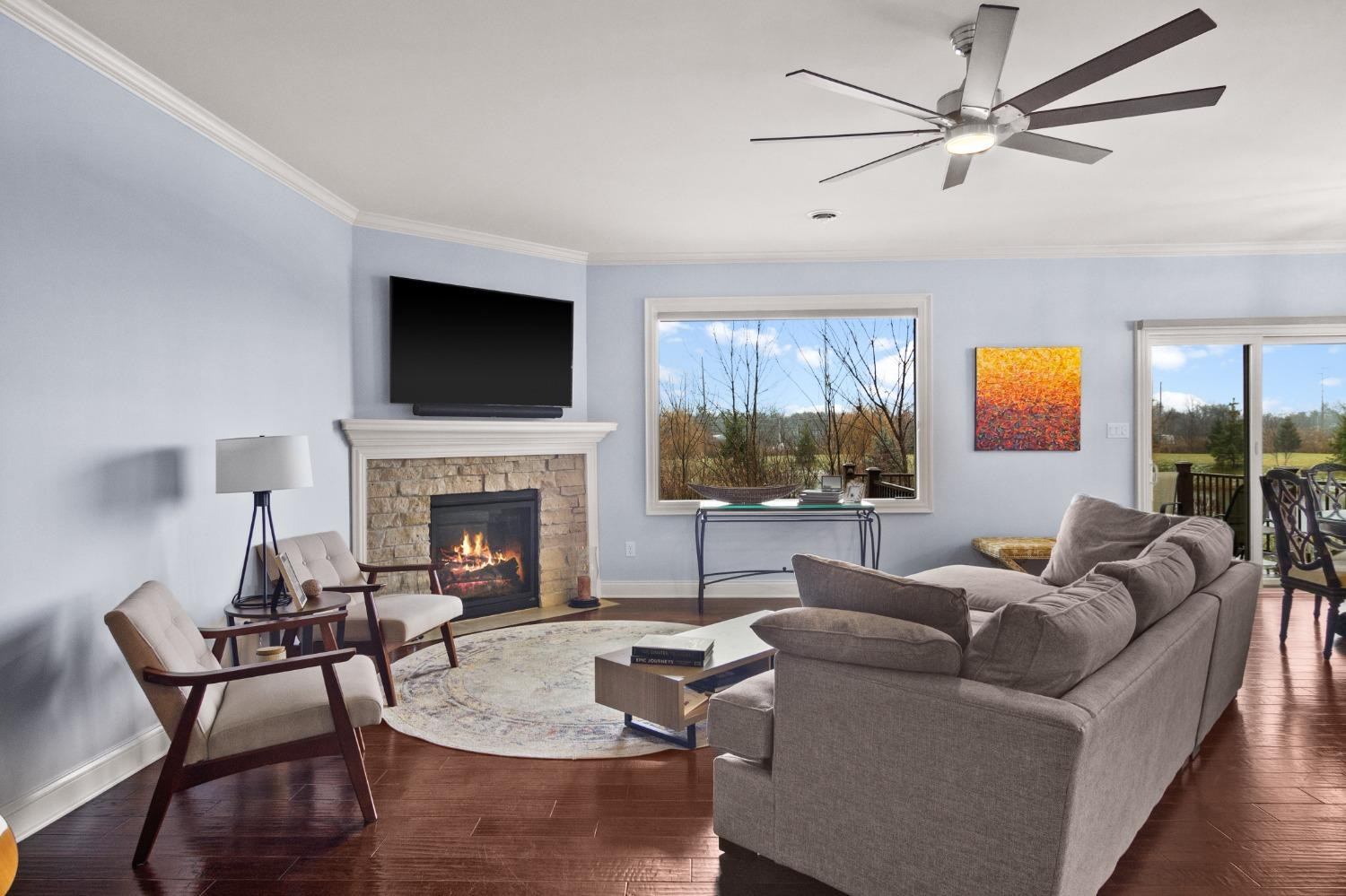 8415 Dancing Waters Lane St. John, IN 46373 - Photo 11 of 31 a living room with furniture a fireplace and a flat screen tv