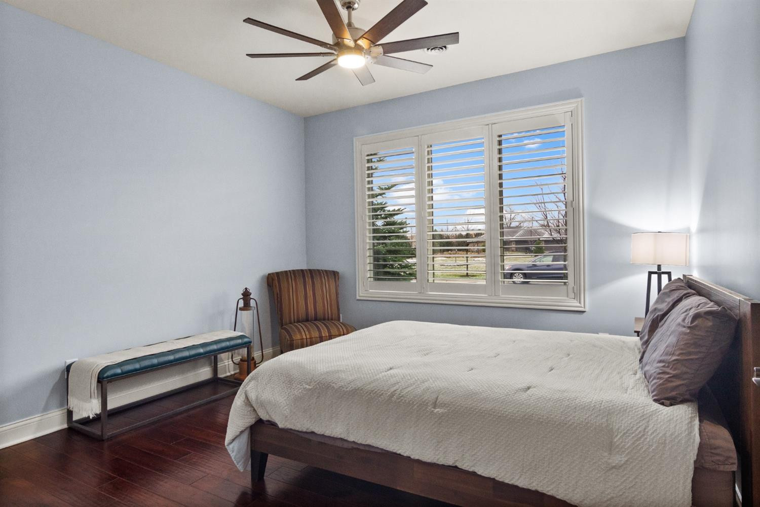 8415 Dancing Waters Lane St. John, IN 46373 - Photo 21 of 31 a bedroom with a bed a chandelier and a chair