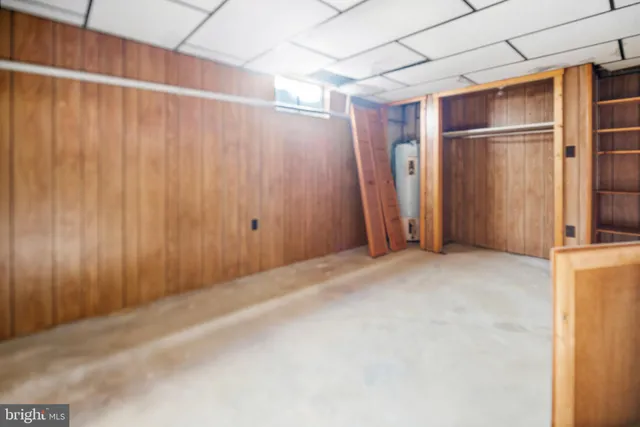 a view of a room with an empty space and a window