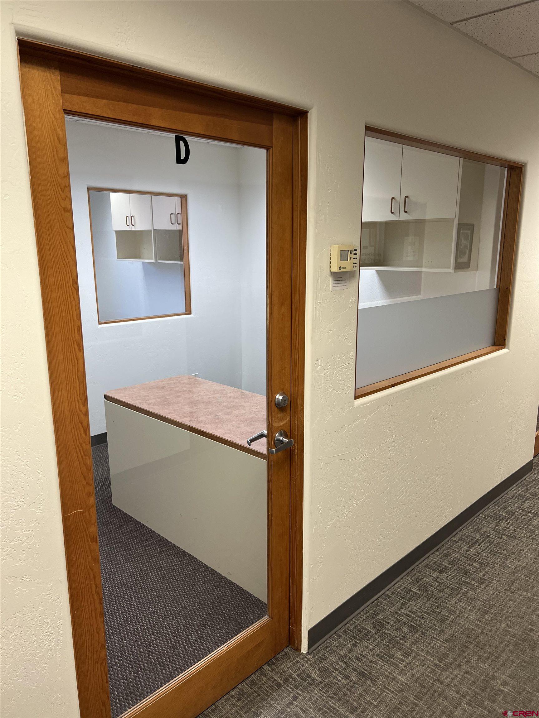 700 Main Avenue, Unit D Durango, CO 81301 - Photo 2 of 13 a hallway with storage and utility