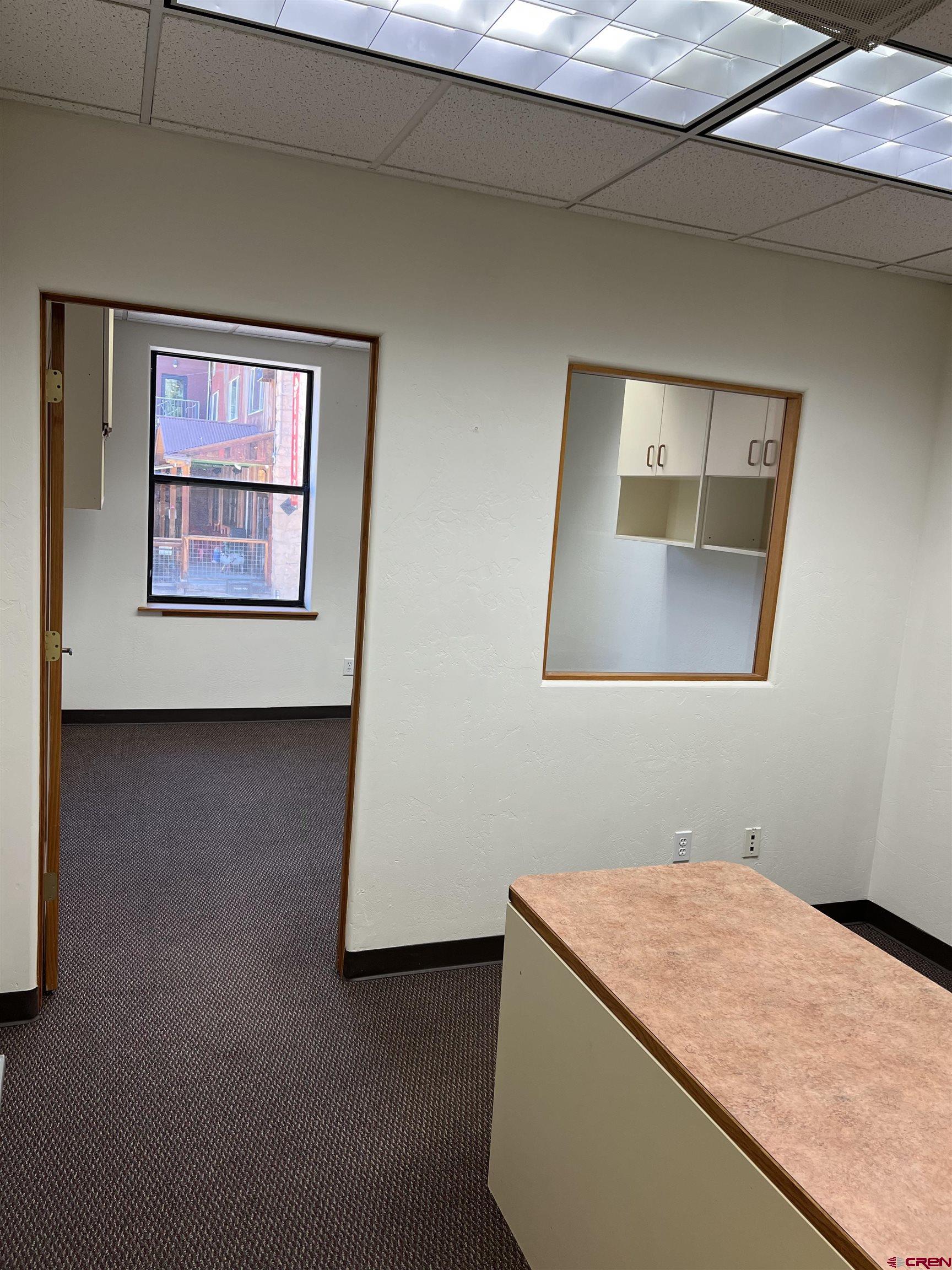 700 Main Avenue, Unit D Durango, CO 81301 - Photo 3 of 13 a view of an empty room with window