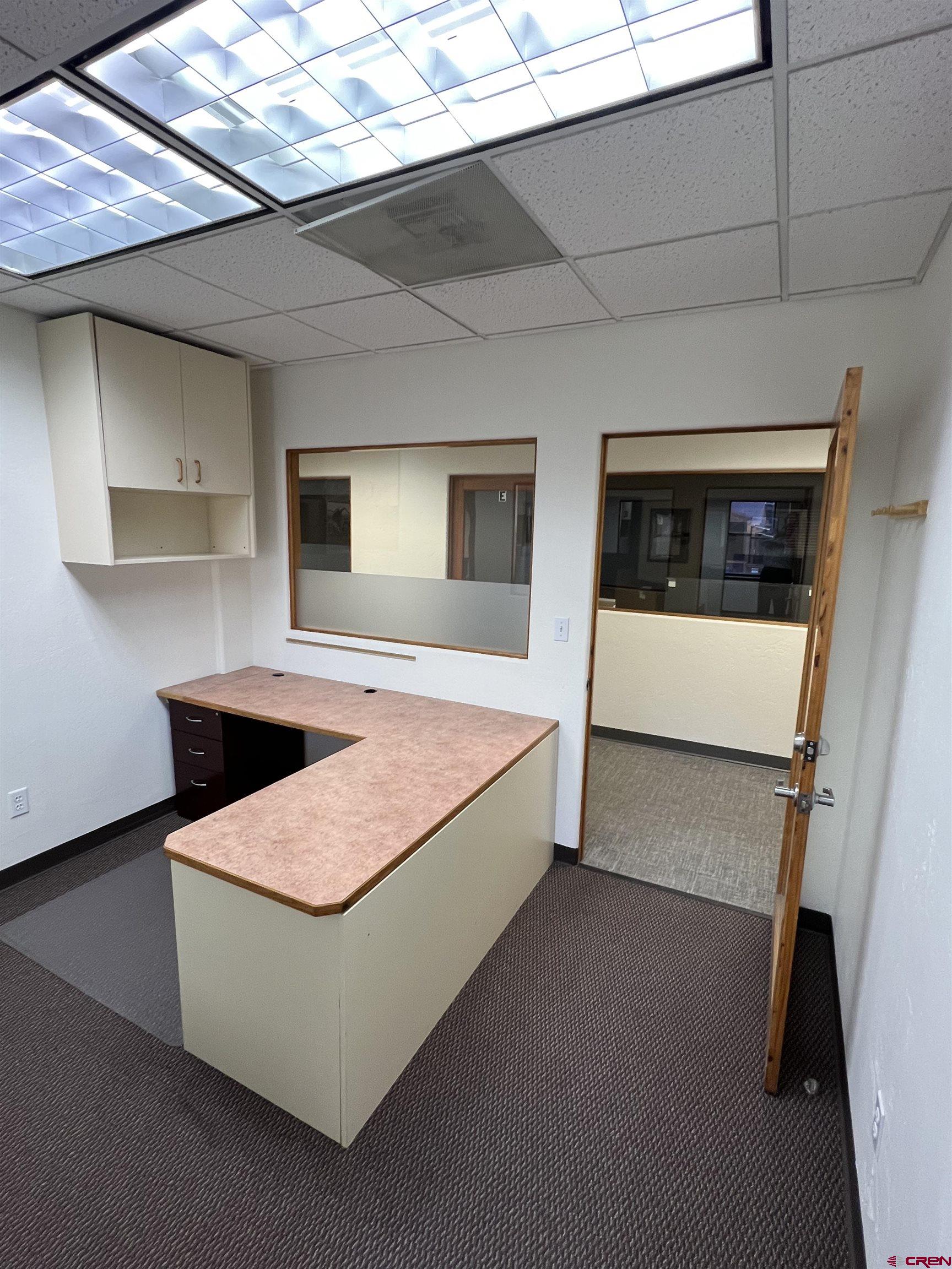 700 Main Avenue, Unit D Durango, CO 81301 - Photo 4 of 13 a living room with granite countertop furniture and a fireplace