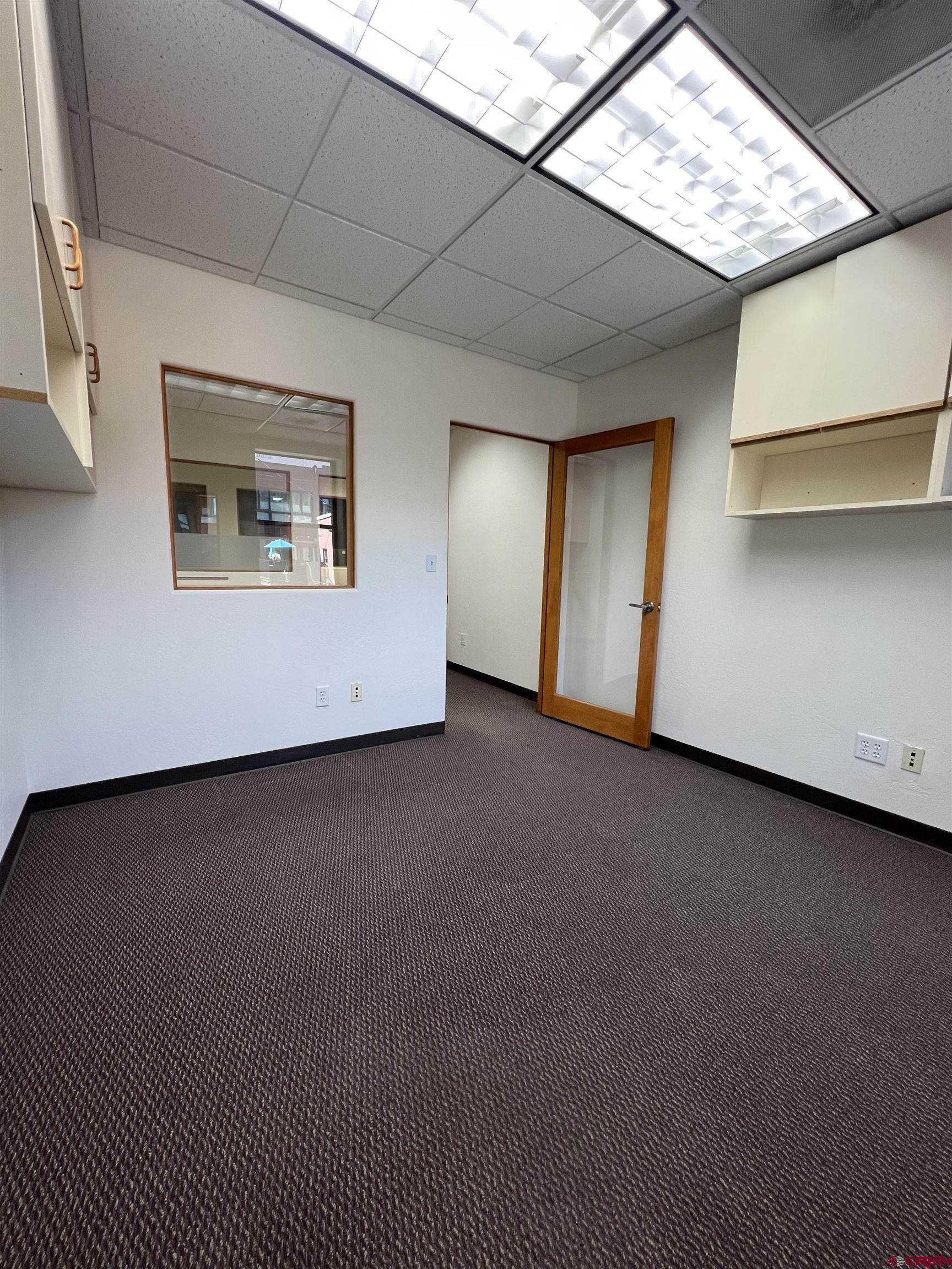 700 Main Avenue, Unit D Durango, CO 81301 - Photo 7 of 13 a view of an empty room with a window