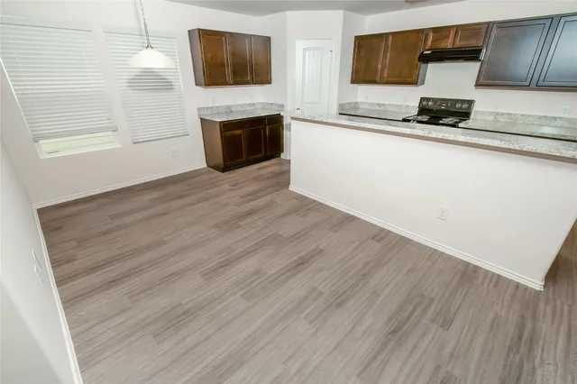 a view of kitchen island wooden floor