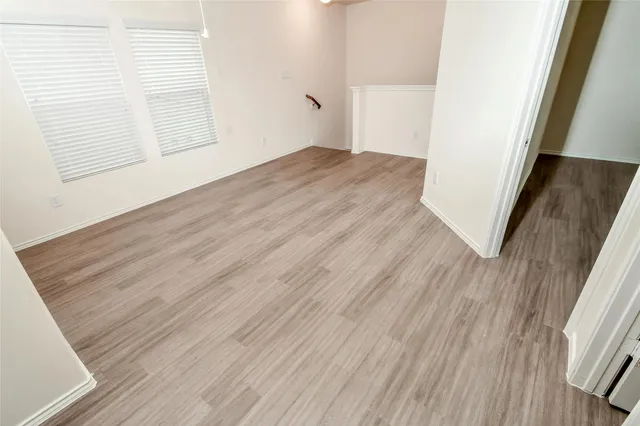 a spacious bathroom with a granite countertop sink a toilet and shower