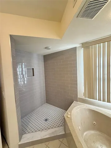 a bathroom with a sink and a shower