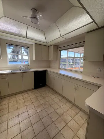 a kitchen with stainless steel appliances a stove sink and microwave