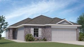 a front view of a house with a garden and plants