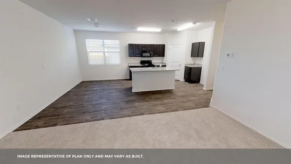 a view of kitchen with sink microwave and refrigerator