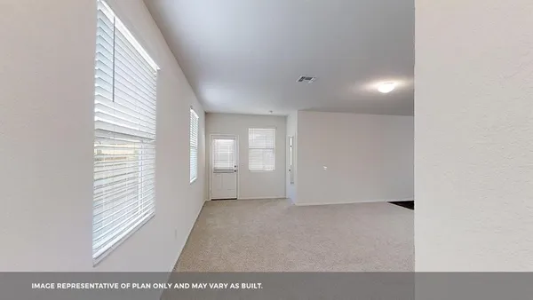 a view of an empty room and a window