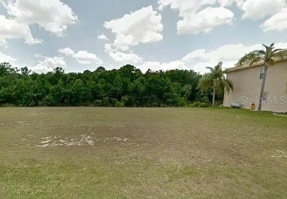 a view of a field with an outdoor space