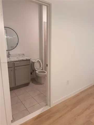 a view of storage and utility room with closet