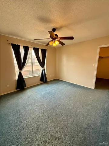 a view of room with air conditioner and windows