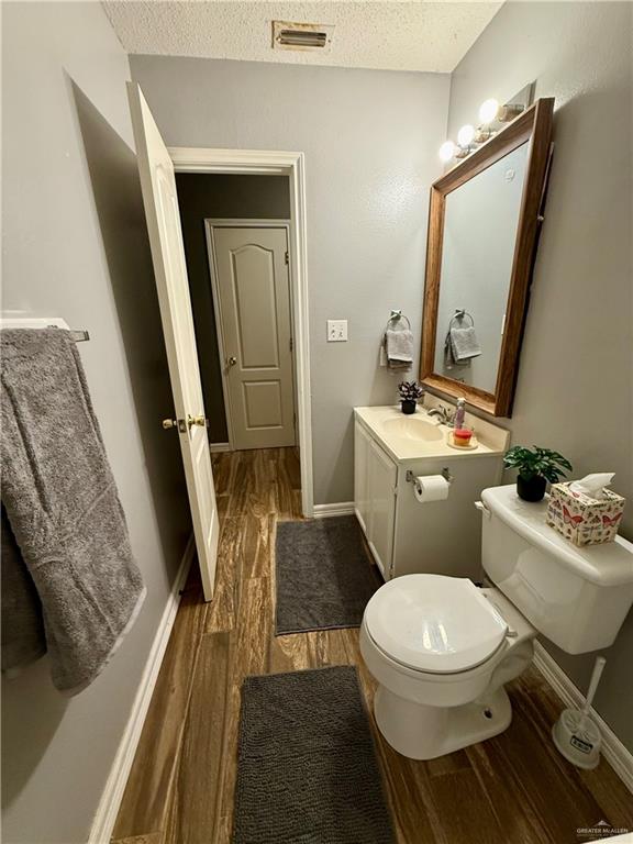 3100 Princeton Avenue McAllen, TX 78504 - Photo 21 of 40 a white toilet sitting next to a bathroom sink