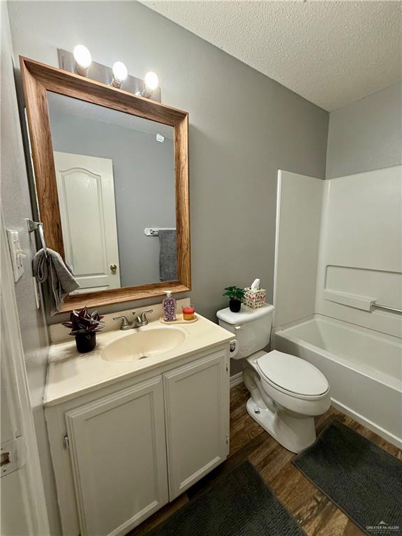 3100 Princeton Avenue McAllen, TX 78504 - Photo 22 of 40 a bathroom with a granite countertop toilet a sink and a mirror