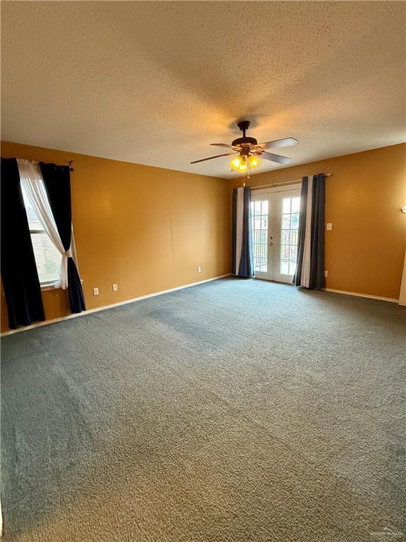 3100 Princeton Avenue McAllen, TX 78504 - Photo 23 of 40 a view of a big room with windows and chandelier fan