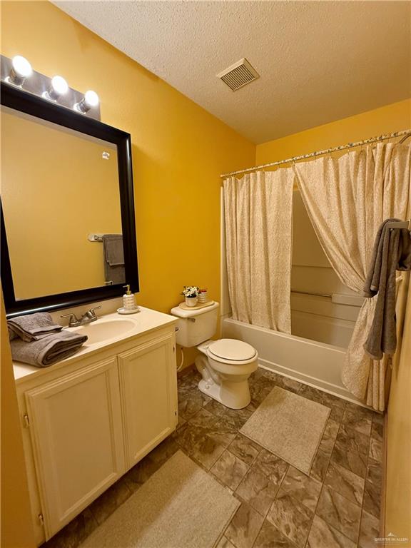 3100 Princeton Avenue McAllen, TX 78504 - Photo 26 of 40 a bathroom with a toilet sink and mirror