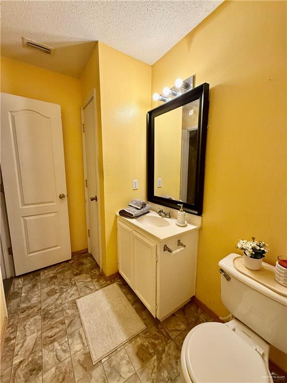 3100 Princeton Avenue McAllen, TX 78504 - Photo 27 of 40 a bathroom with a granite countertop sink toilet and shower