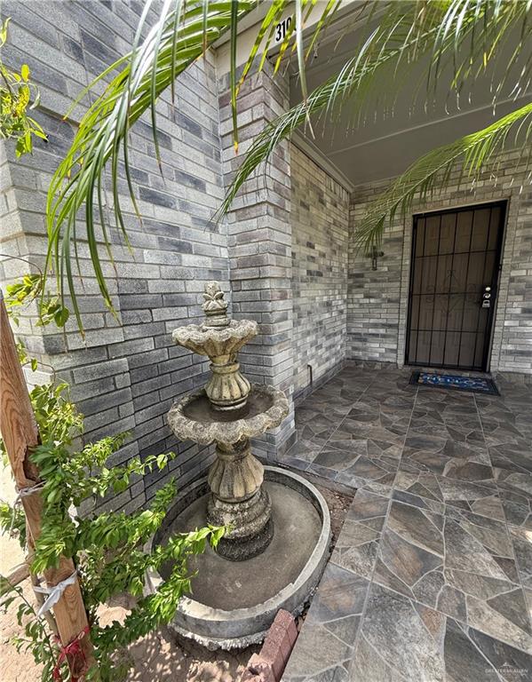 3100 Princeton Avenue McAllen, TX 78504 - Photo 38 of 40 a view of a fireplace with an empty room