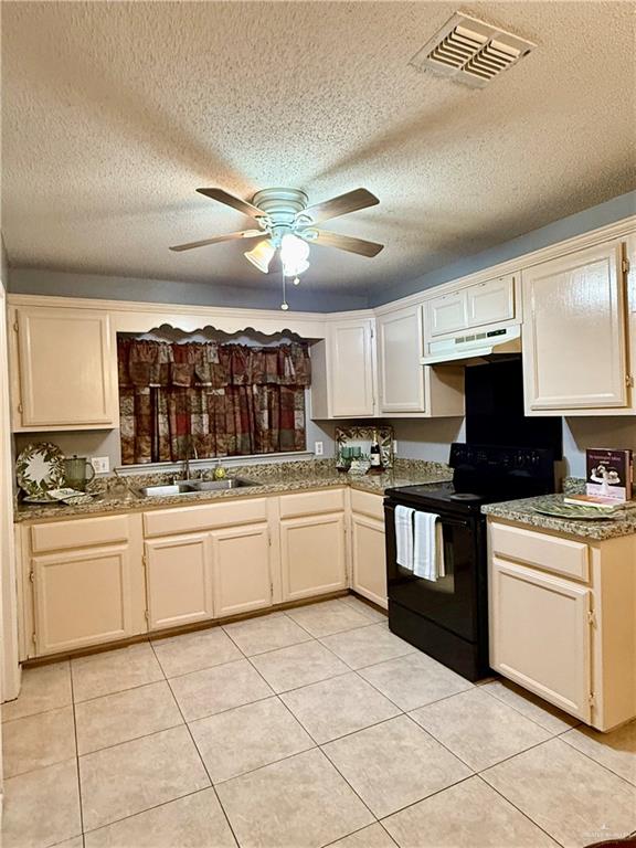 3100 Princeton Avenue McAllen, TX 78504 - Photo 6 of 40 a kitchen with granite countertop cabinets a stove a sink and a counter top space