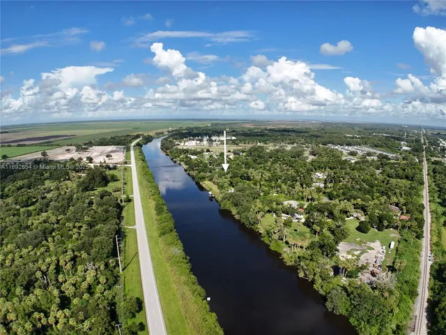 a view of a field with an ocean