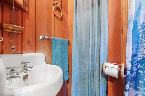 a bathroom with a tub and shower
