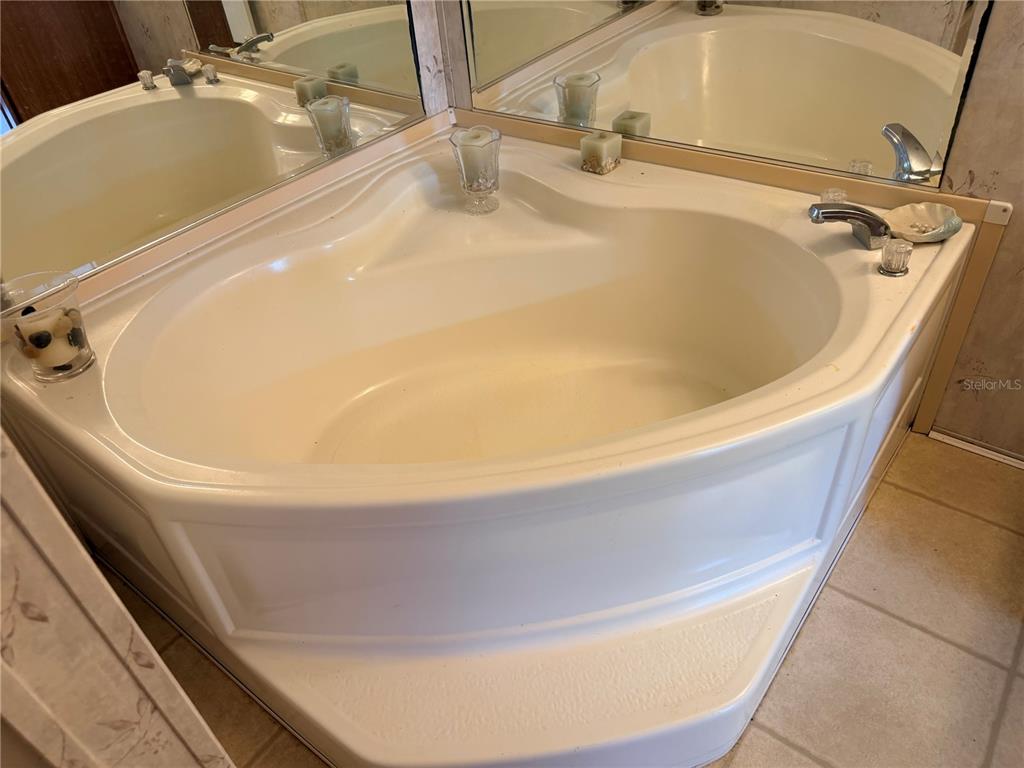 33 Ridge Road Frostproof, FL 33843 - Photo 12 of 21 a bath tub sitting in a bathroom