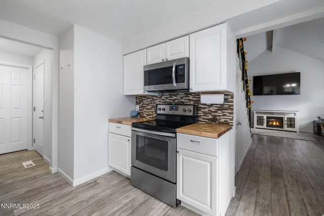 a kitchen with a stove and a microwave