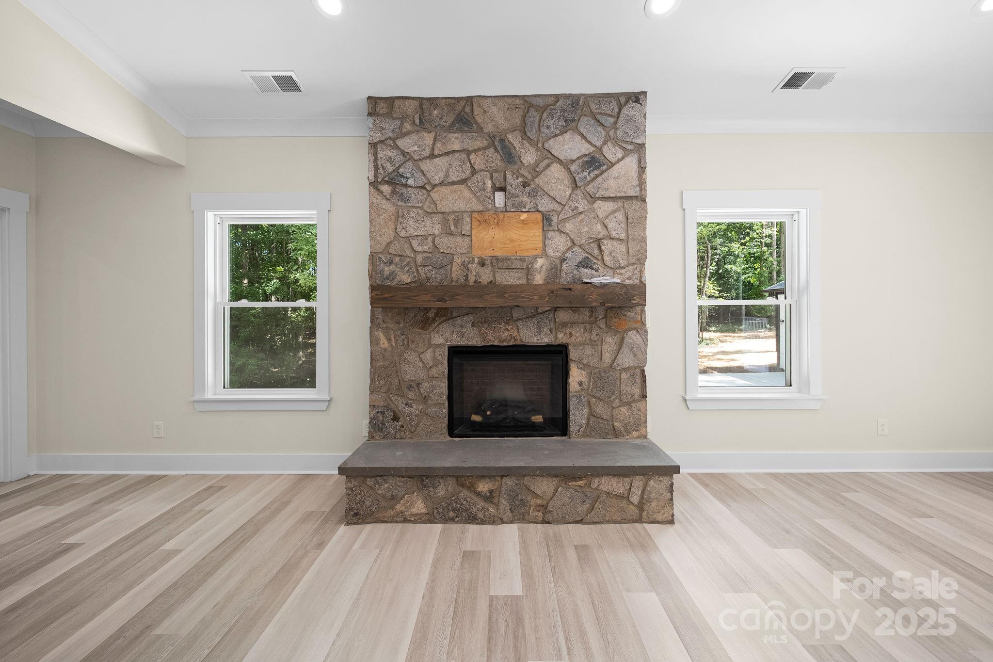 4460 R R L Lane Midland, NC 28107 - Photo 12 of 48 a living room with a fireplace and a window