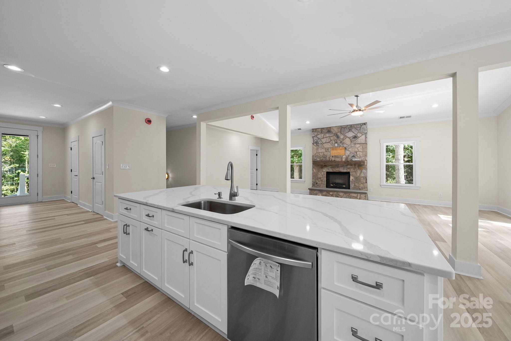 4460 R R L Lane Midland, NC 28107 - Photo 18 of 48 a kitchen with a sink dishwasher a stove and a refrigerator with wooden floor