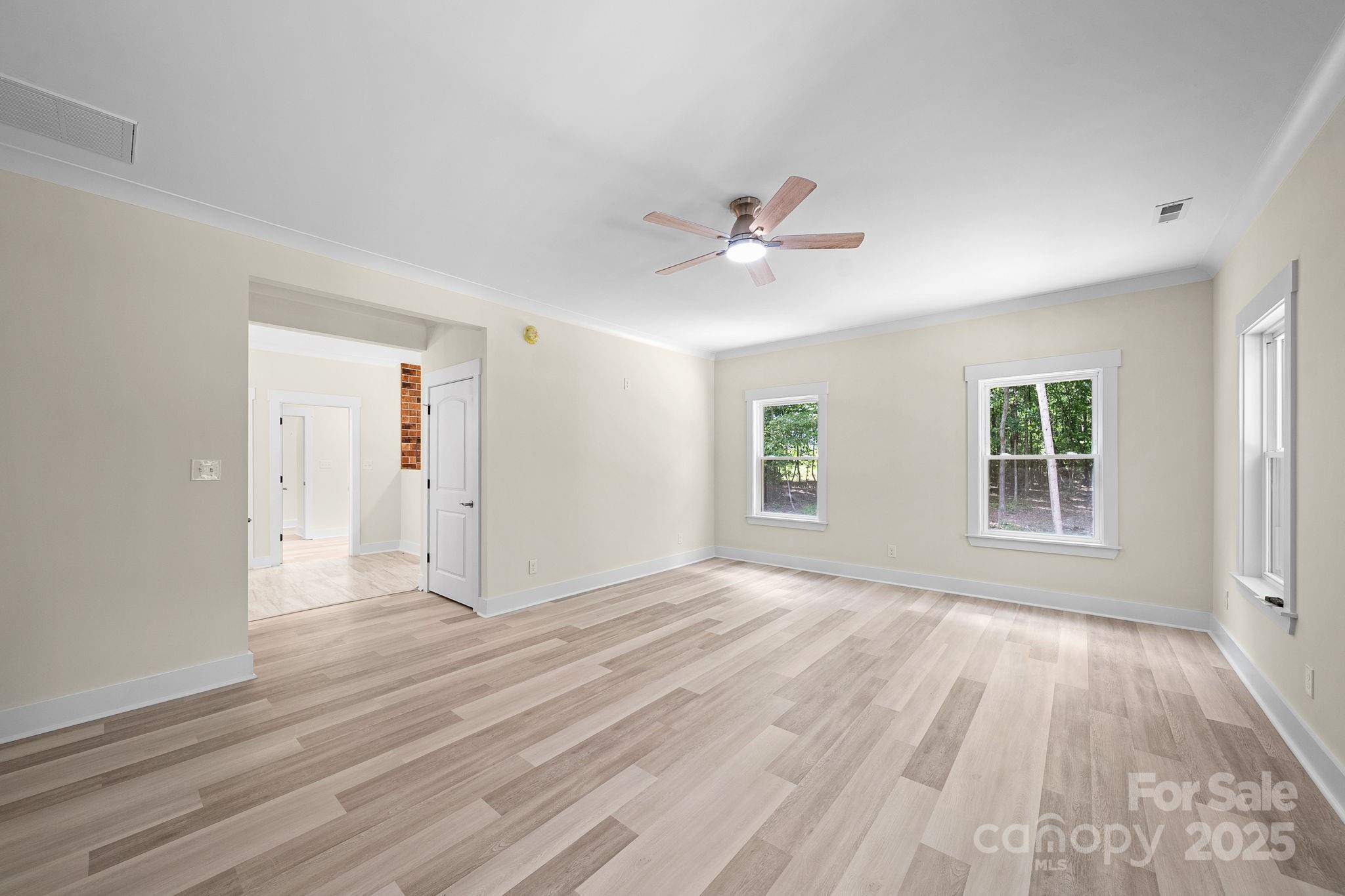 4460 R R L Lane Midland, NC 28107 - Photo 22 of 48 a view of an empty room with a window and a kitchen