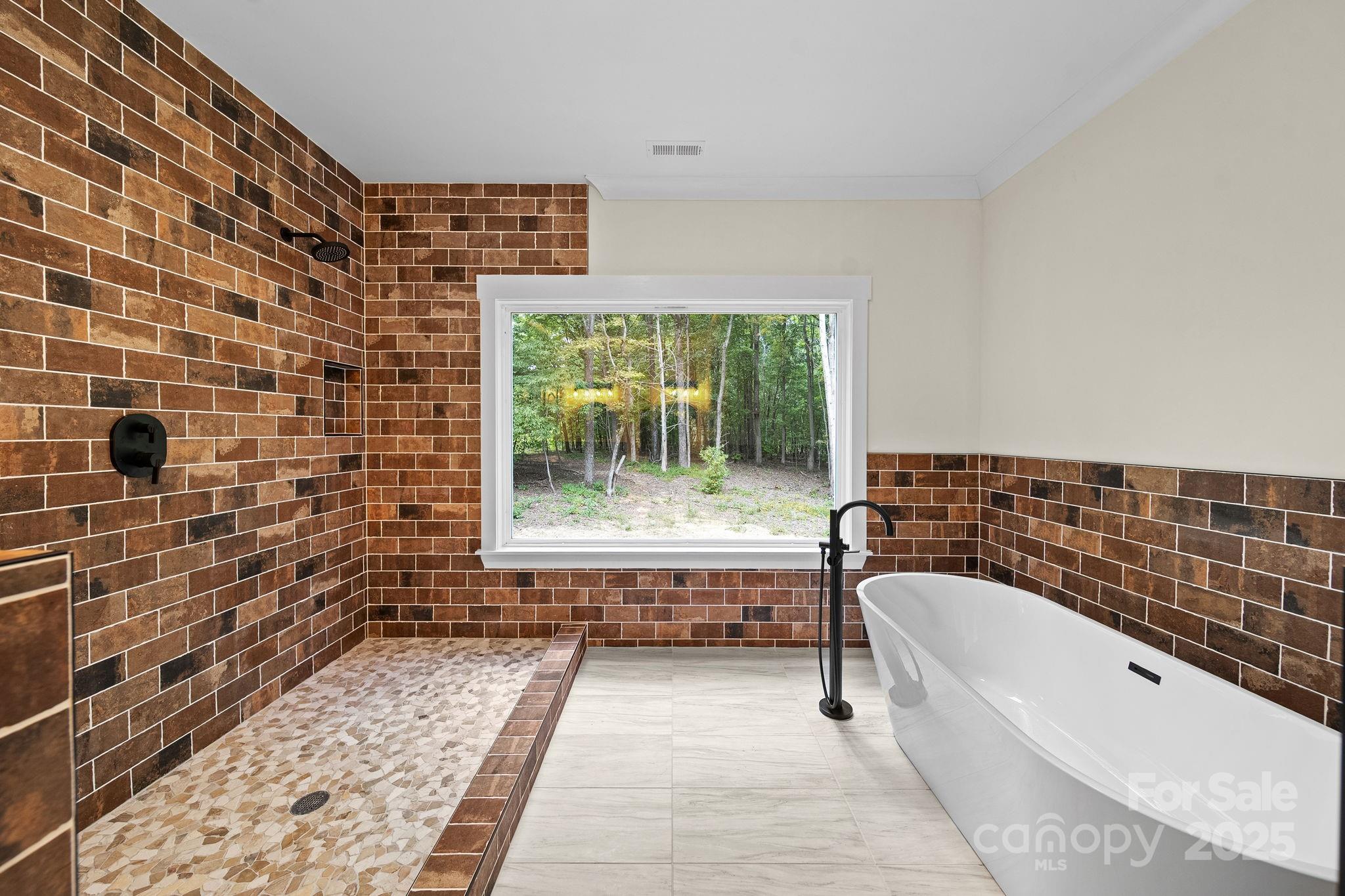4460 R R L Lane Midland, NC 28107 - Photo 23 of 48 a bathroom with a bathtub and next to a window
