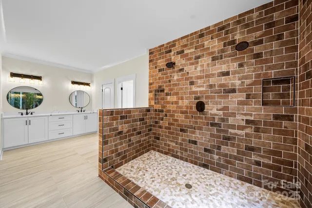 a bathroom with a bathtub and a shower