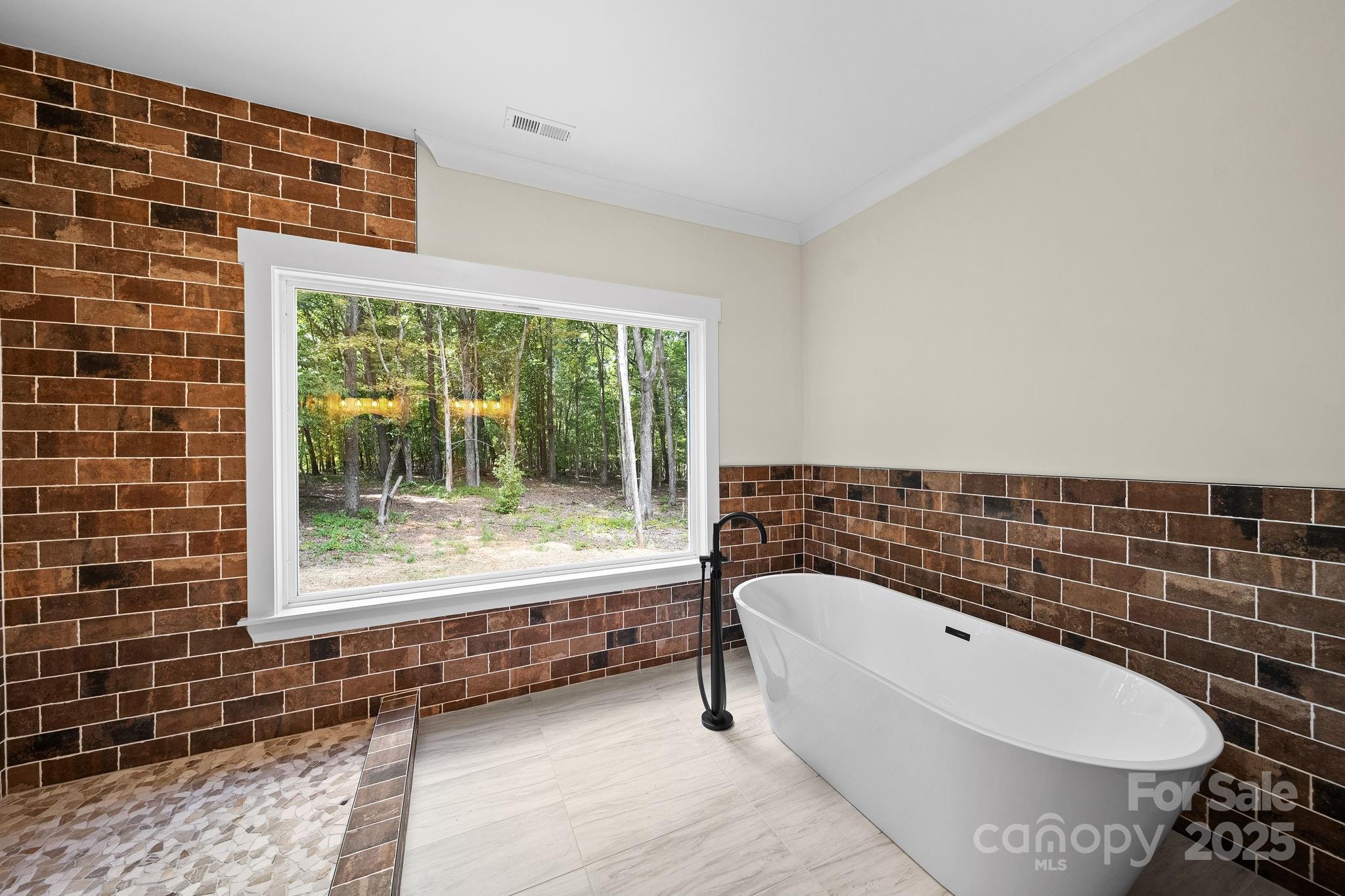 4460 R R L Lane Midland, NC 28107 - Photo 25 of 48 a bathroom with a bathtub and window